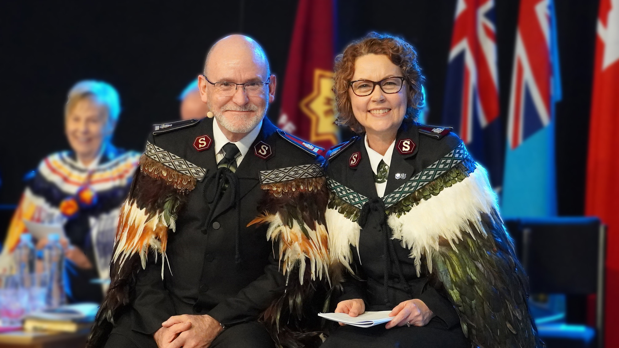 General Lyndon Buckingham and Commissioner Bronwyn Buckingham in full Salvation Army uniform and feathered Korowai (Māori cloak)