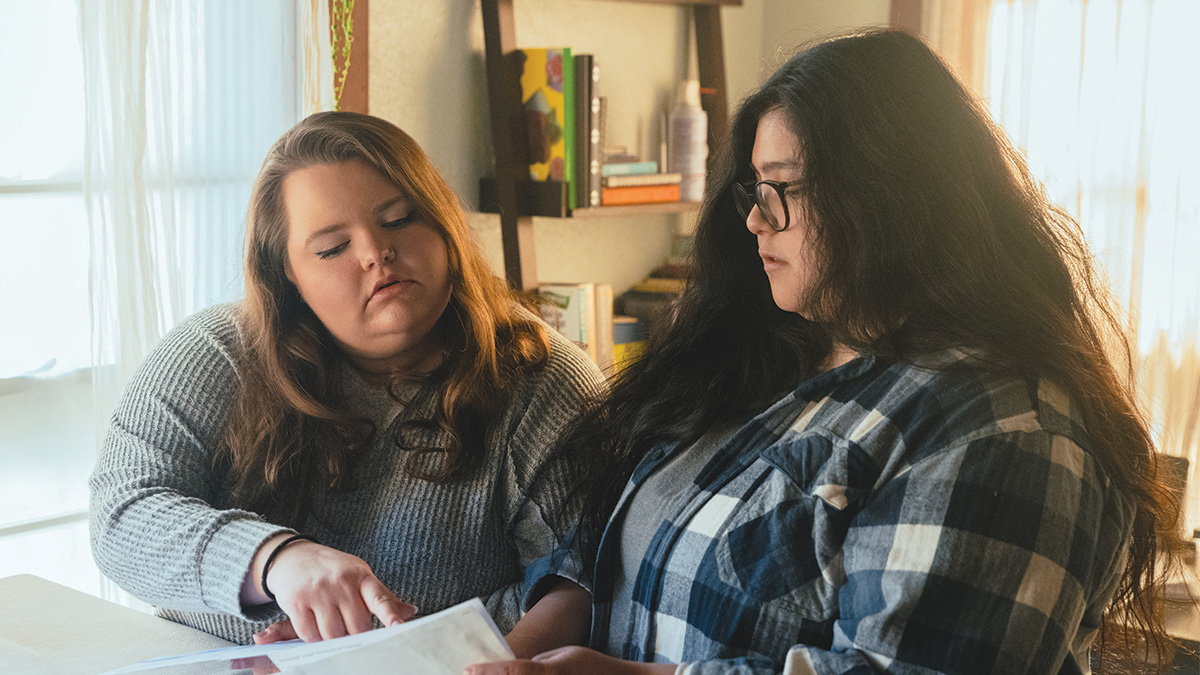Two women review a document