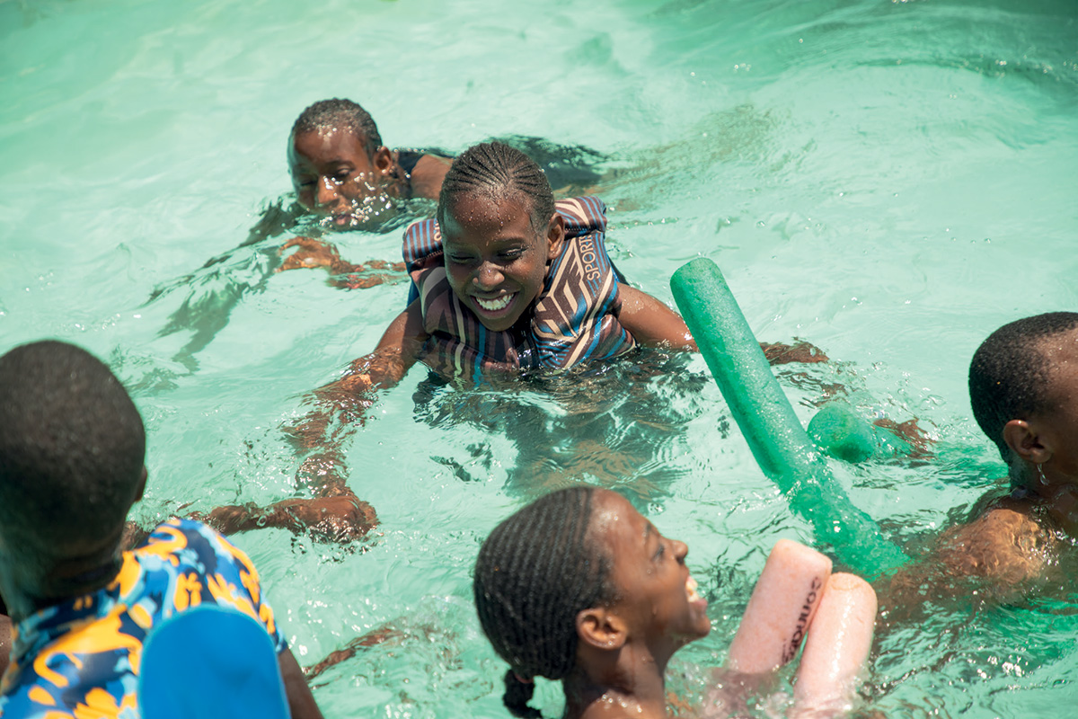 Children play in a swimming pool
