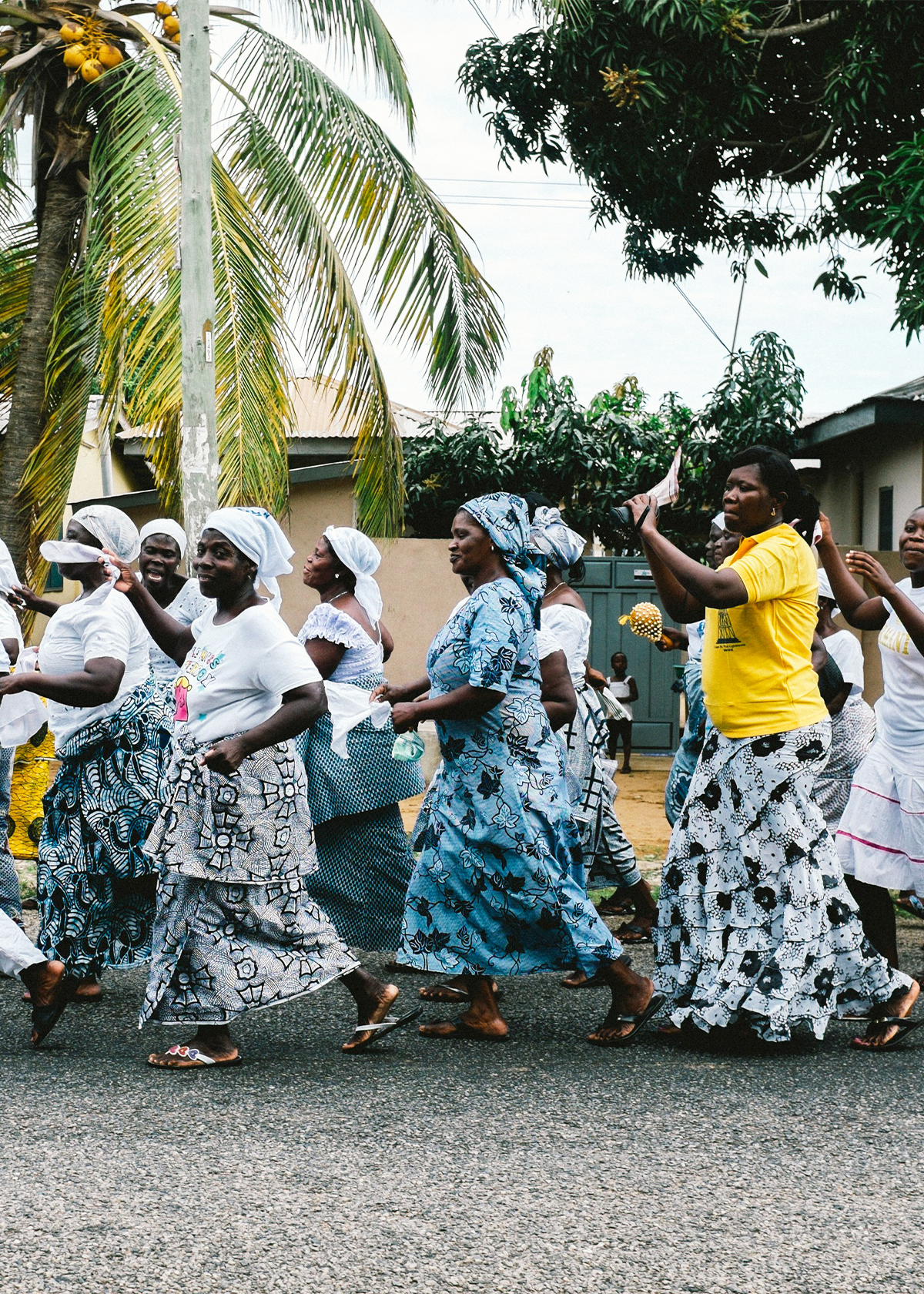 A group of women process through the street