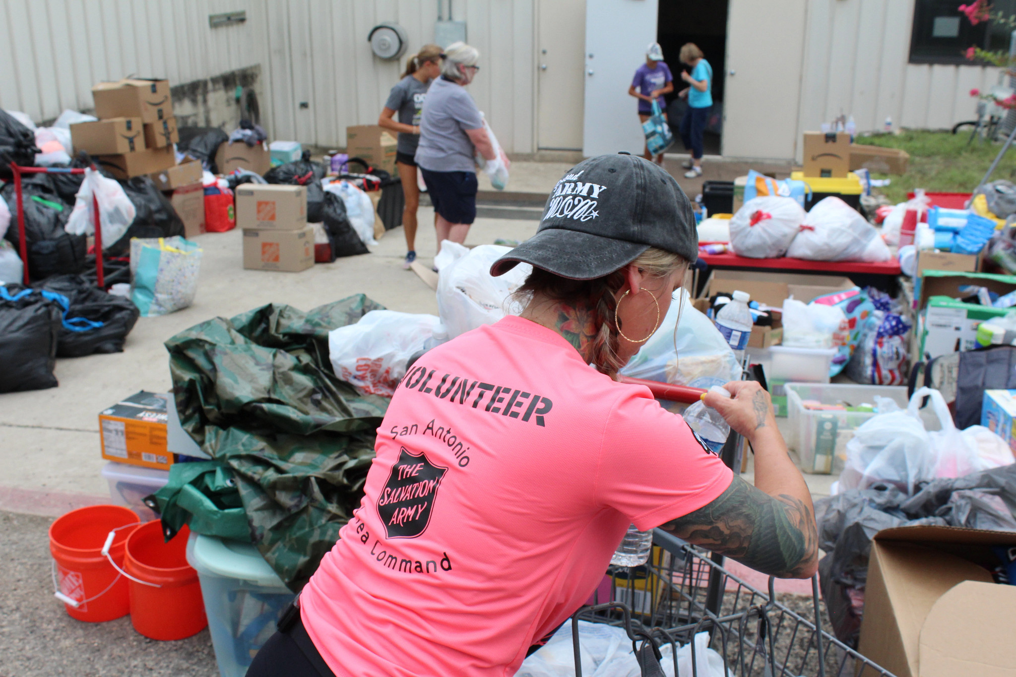 A Salvation Army volunteer sorts supplies