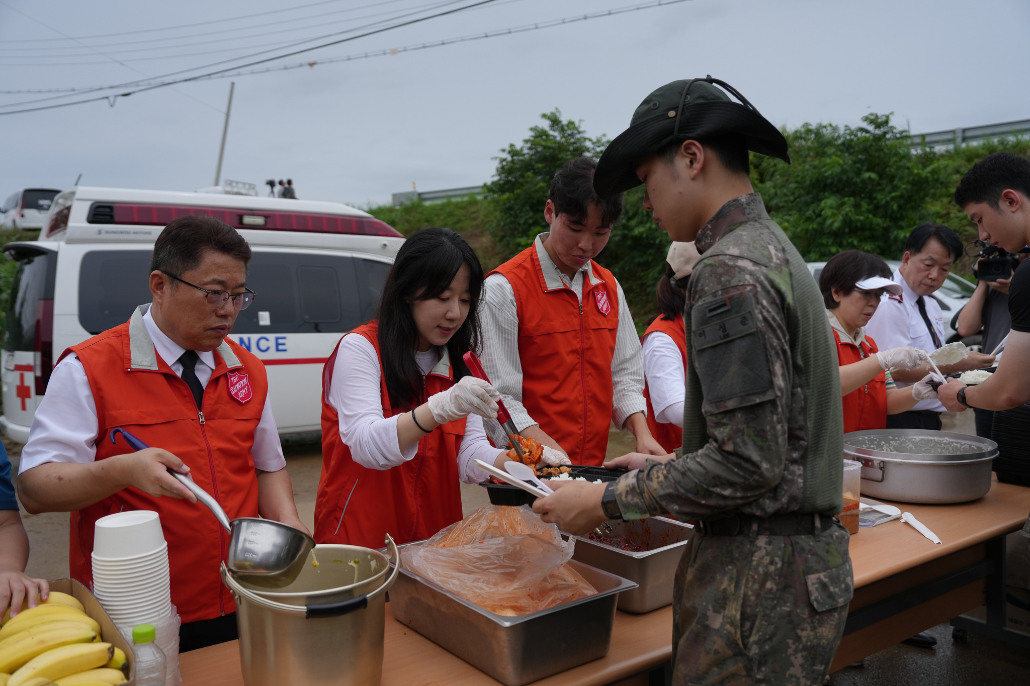 Salvation Army volunteers serve food