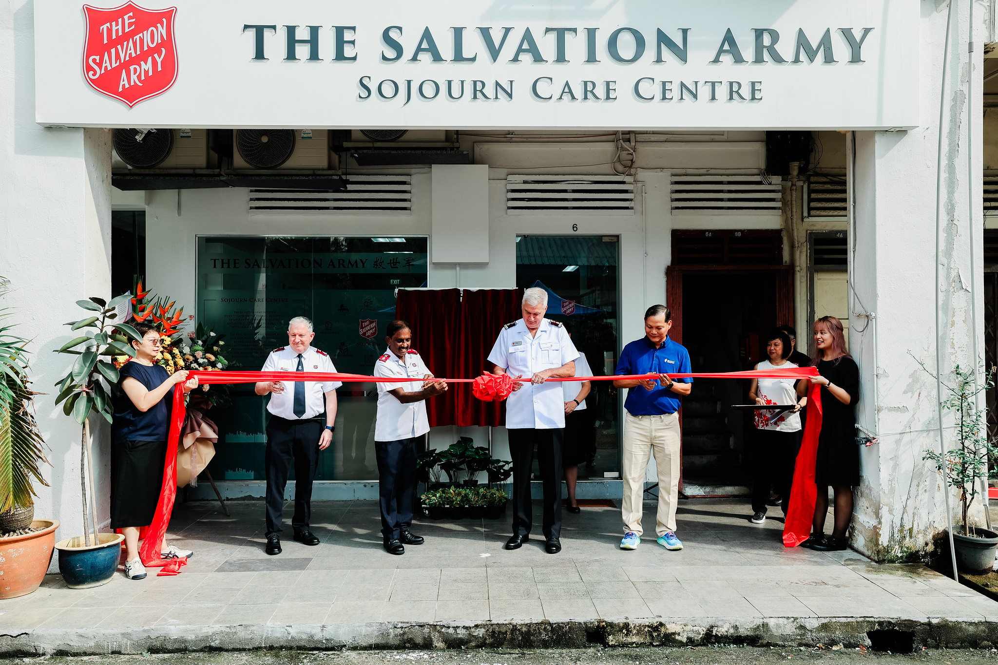 The Chief of the Staff cuts a ribbon outside the new care centre