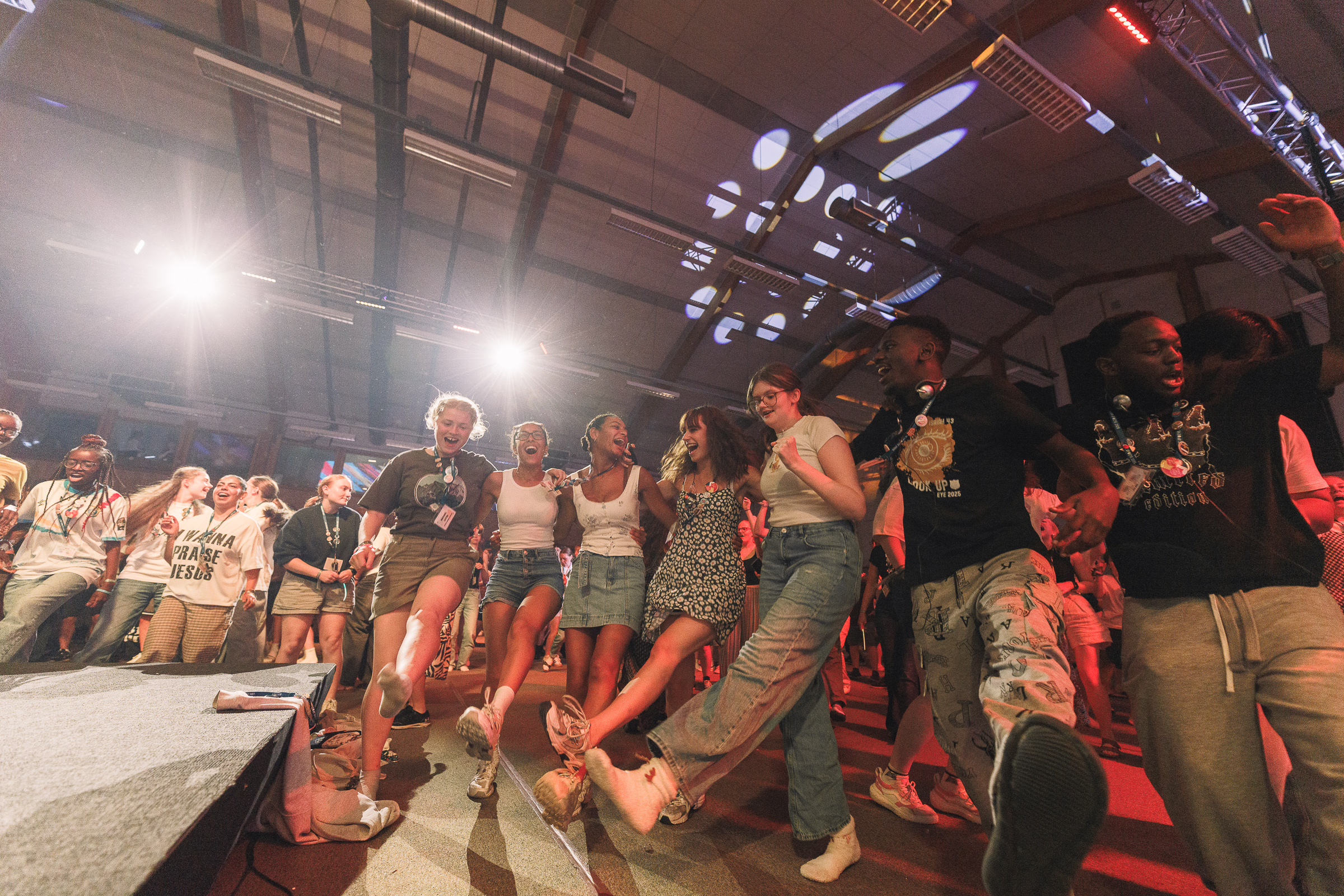 Young people dance together in a group