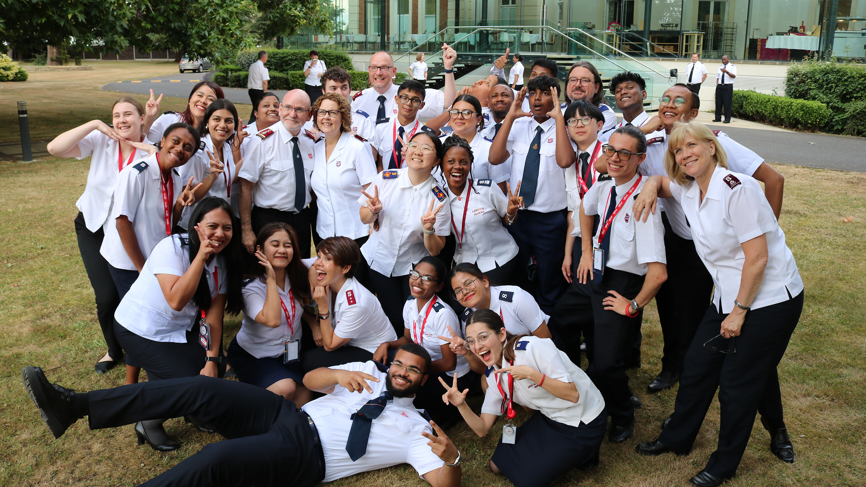 A group of young people in Salvation Army uniform smile at the camera