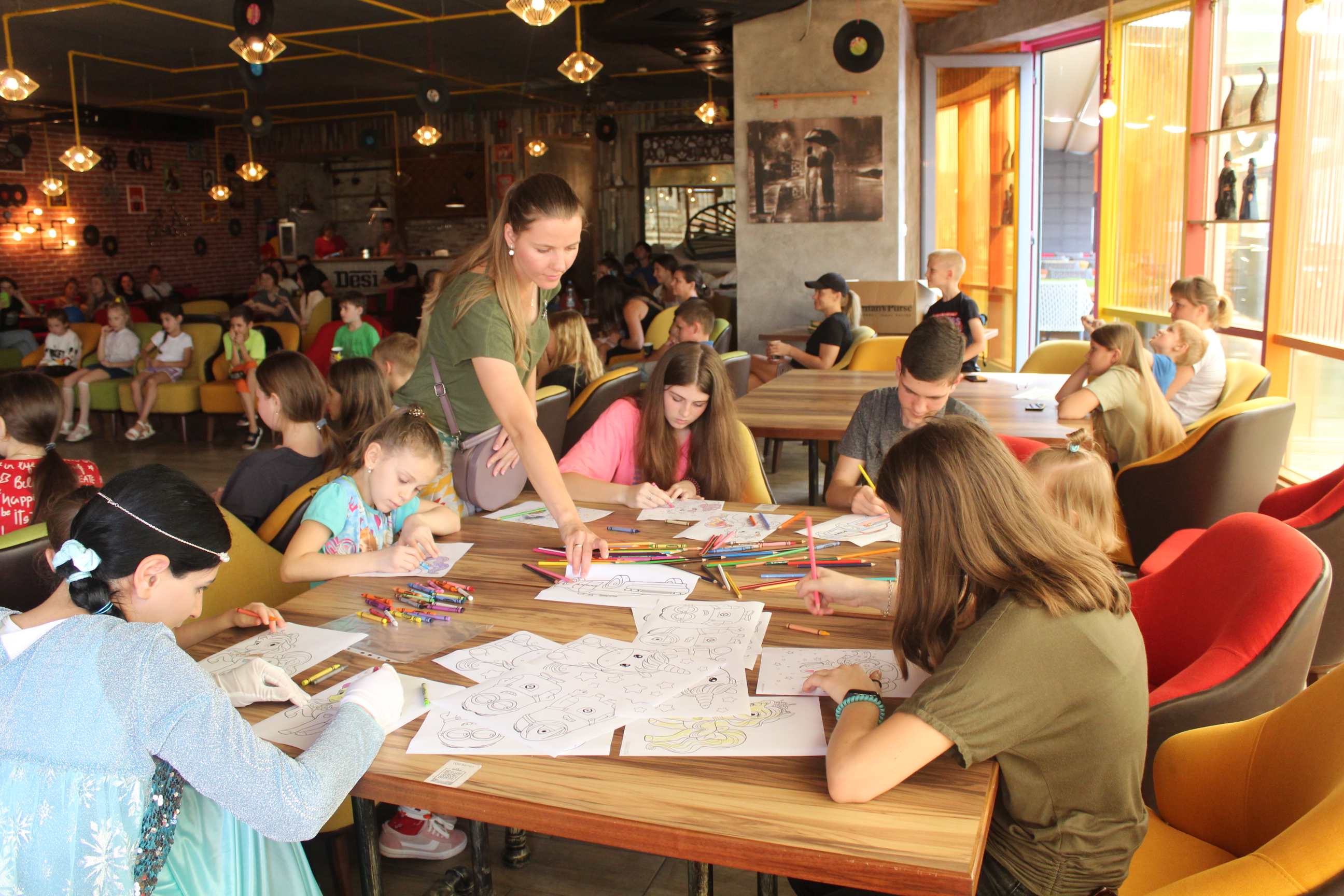 Children complete colouring sheets