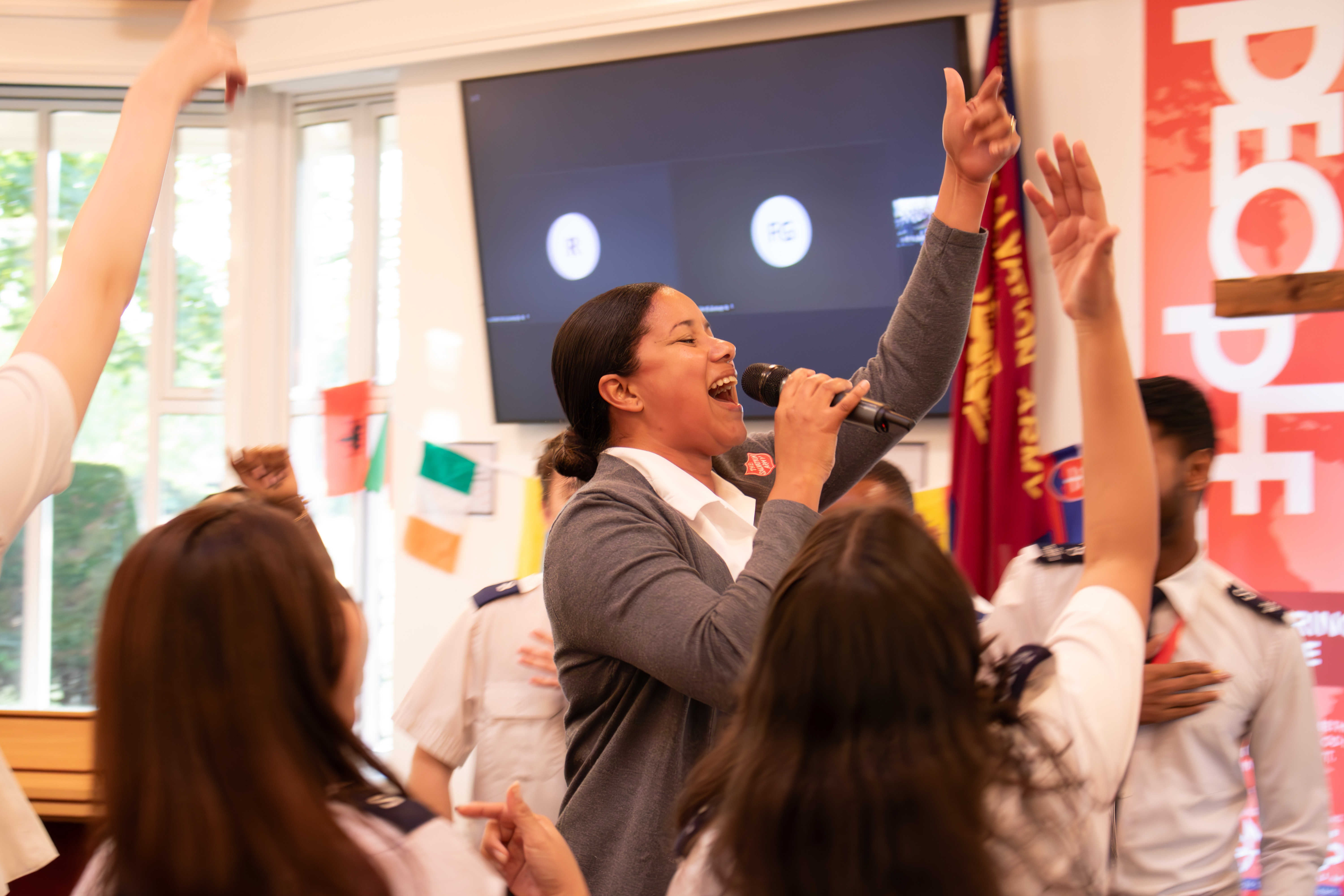Young Salvationists sing in worship