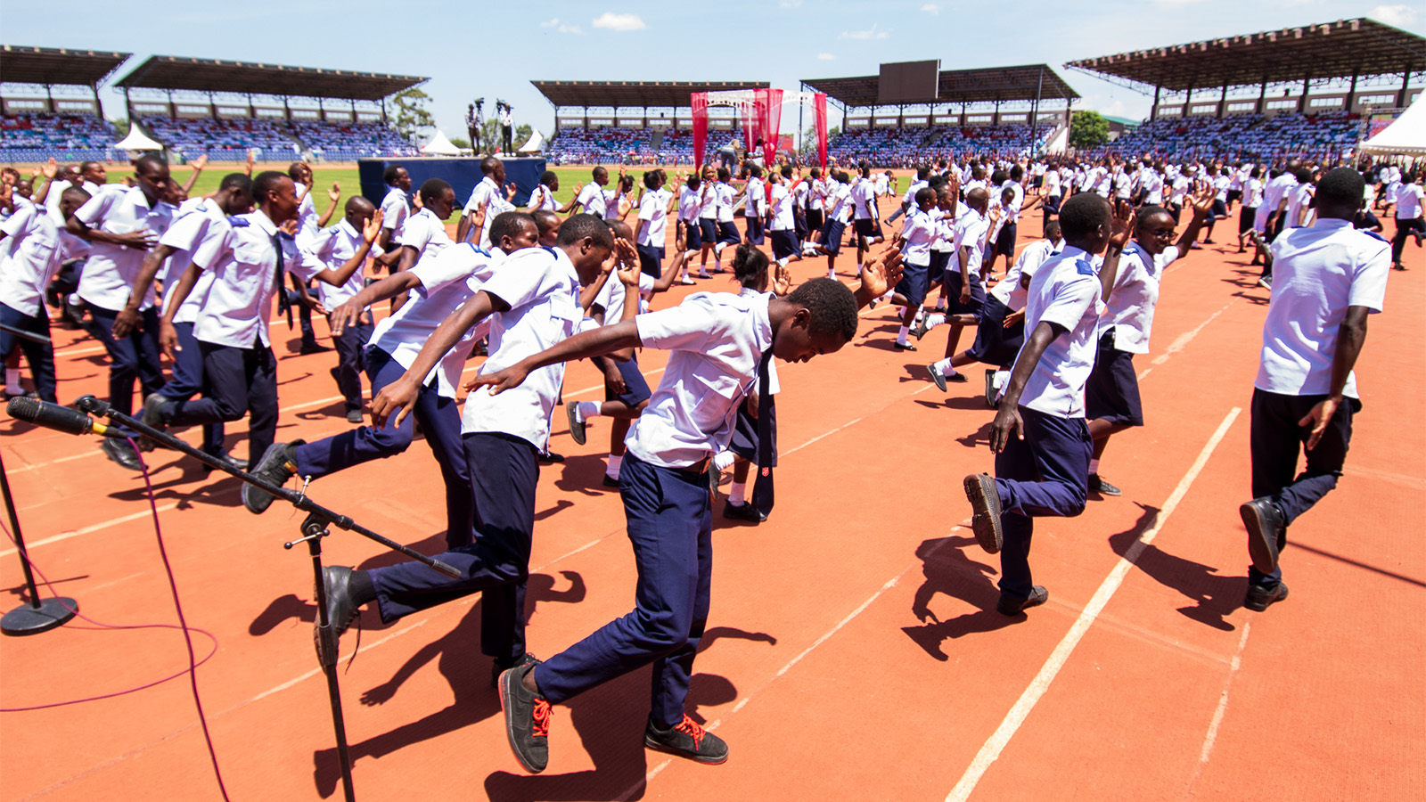 Young people dance at the centenary celebration