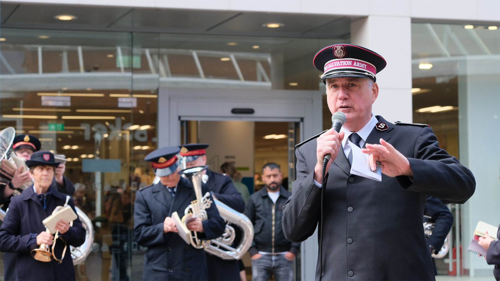 Commissioner Edward Hill speaks at an open-air meeting