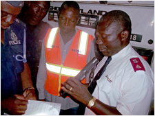 Major Justice Incoom helping representatives of the emergency services