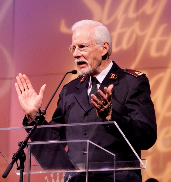 General Paul Rader (Rtd) speaks in front of a microphone