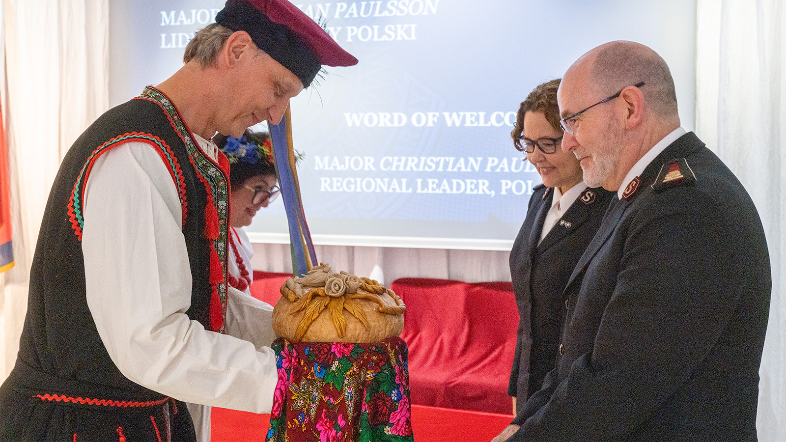 The international leaders receive a traditional welcome to Poland
