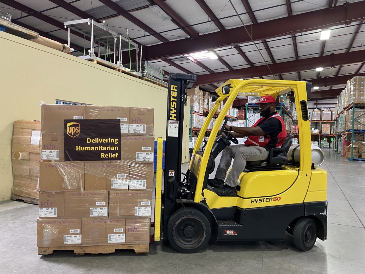Fork-lift truck loading Salvation Army emergency supplies