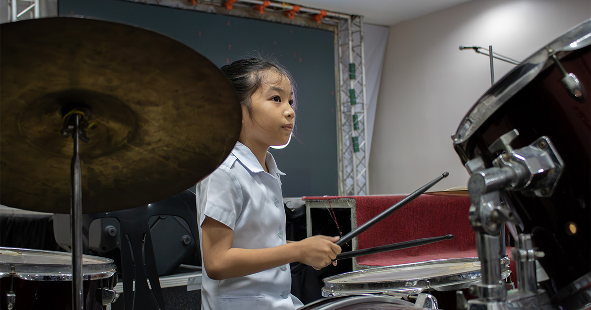 A member of the youth brass band plays at CB Mall