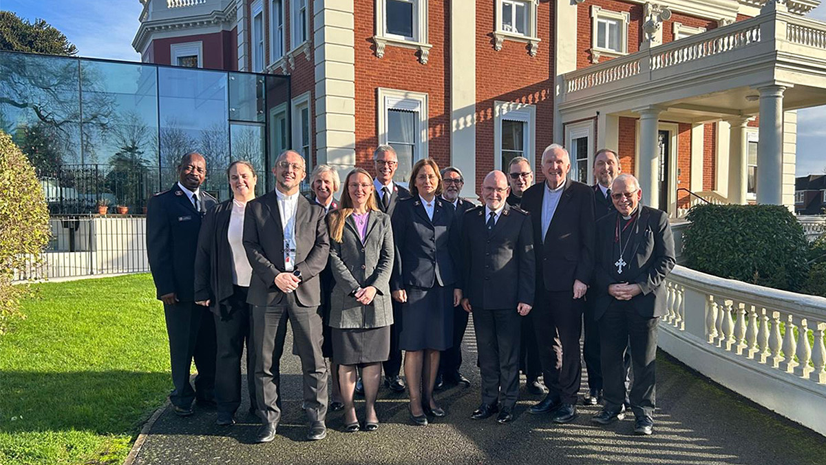 Representatives from The Salvation Army and the Catholic Church stand in from of Sunbury Court Conference Centre