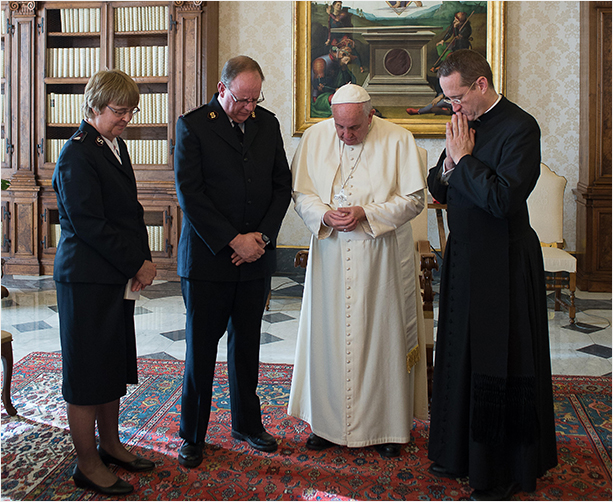 The General, Commissioner Silvia Cox and His Holiness Pope Francis pray together in the Vatican