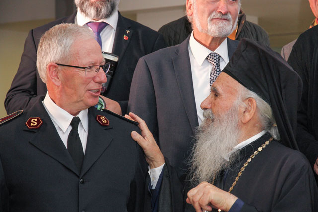 The General and the Archbishop greet each other