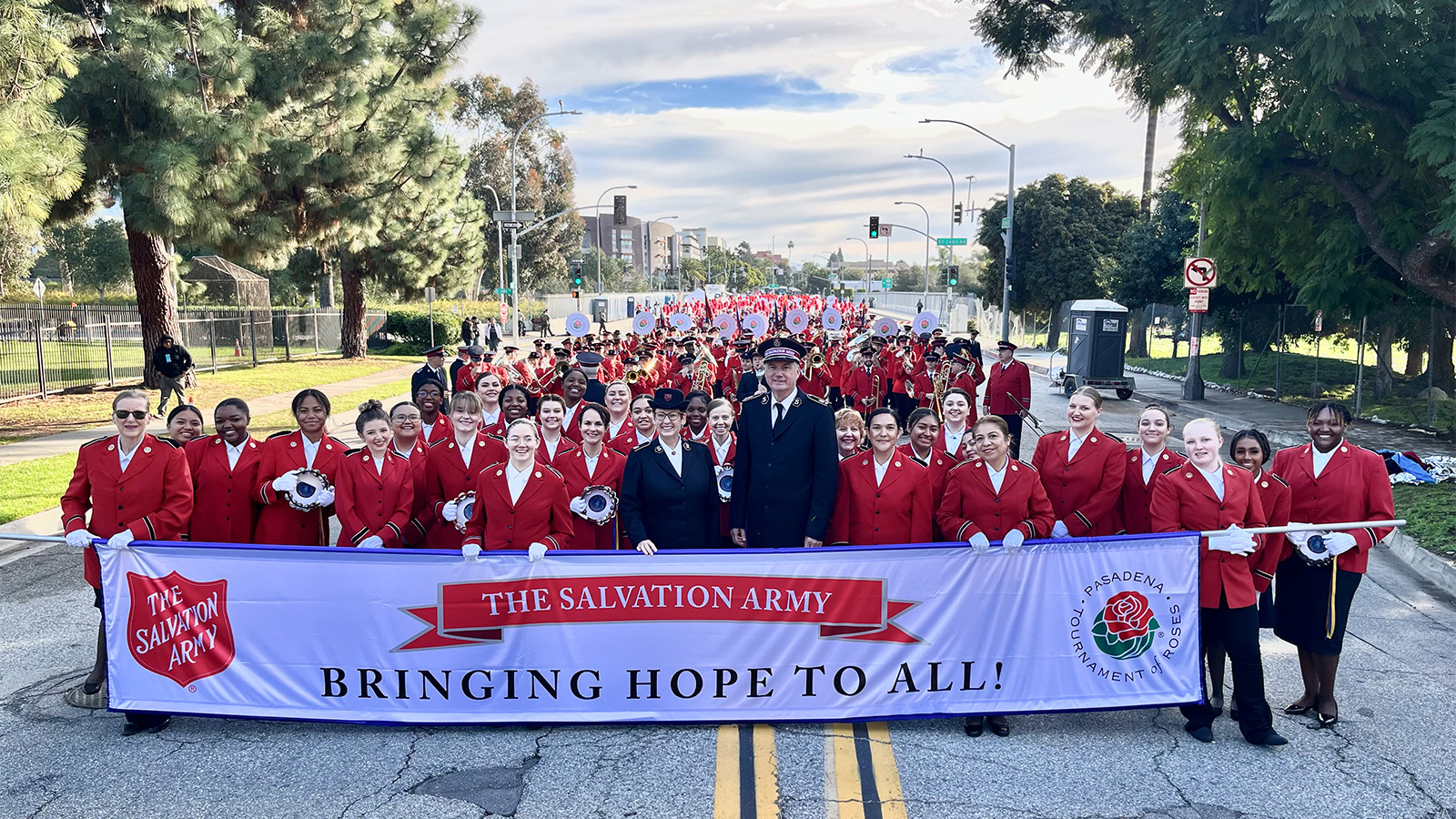 The Salvation Army 2024 Tournament of Roses Band, including Commissioners Edward and Shelley Hill (centre), prepares to step off on the 135th Tournament of Roses Rose Parade route in Pasadena, California