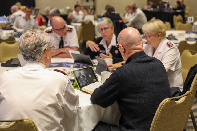 Delegates discuss the content of the day