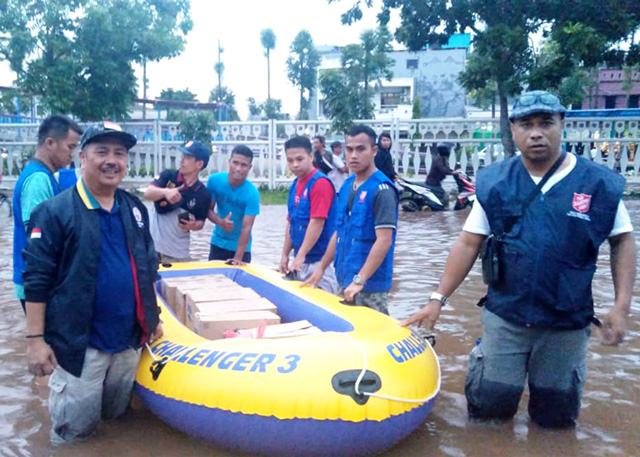 Salvation Army response teams in floodwaters in Indonesisa