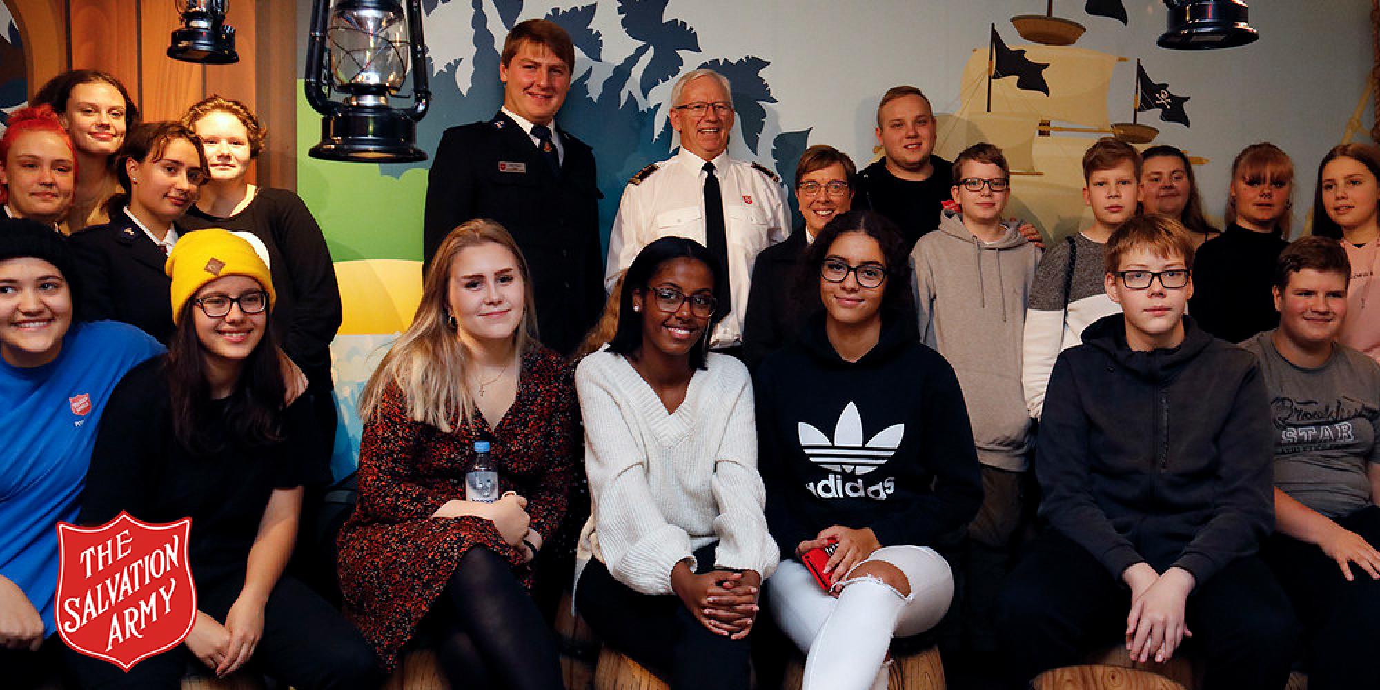 General with young people in Finland