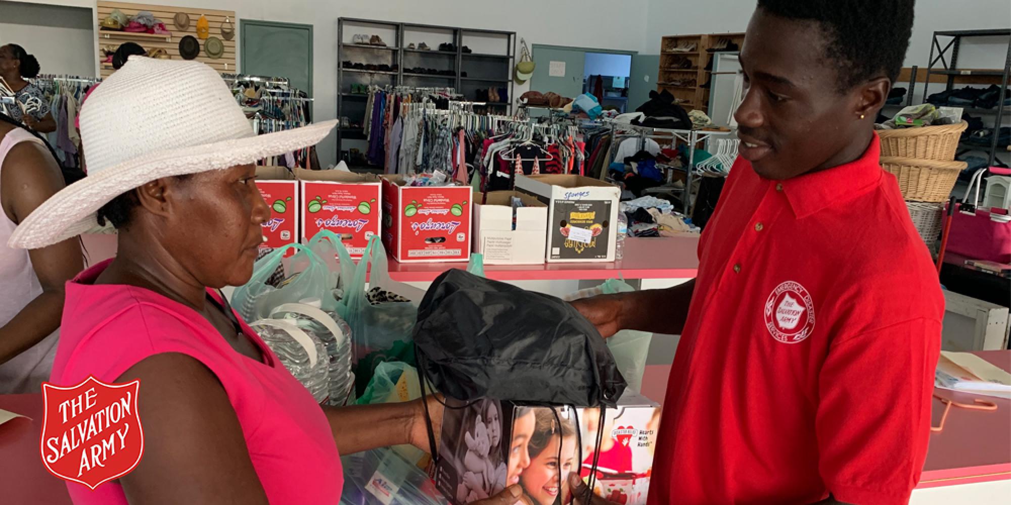 Akeem Cooper helping at the Freeport Salvation Army centre