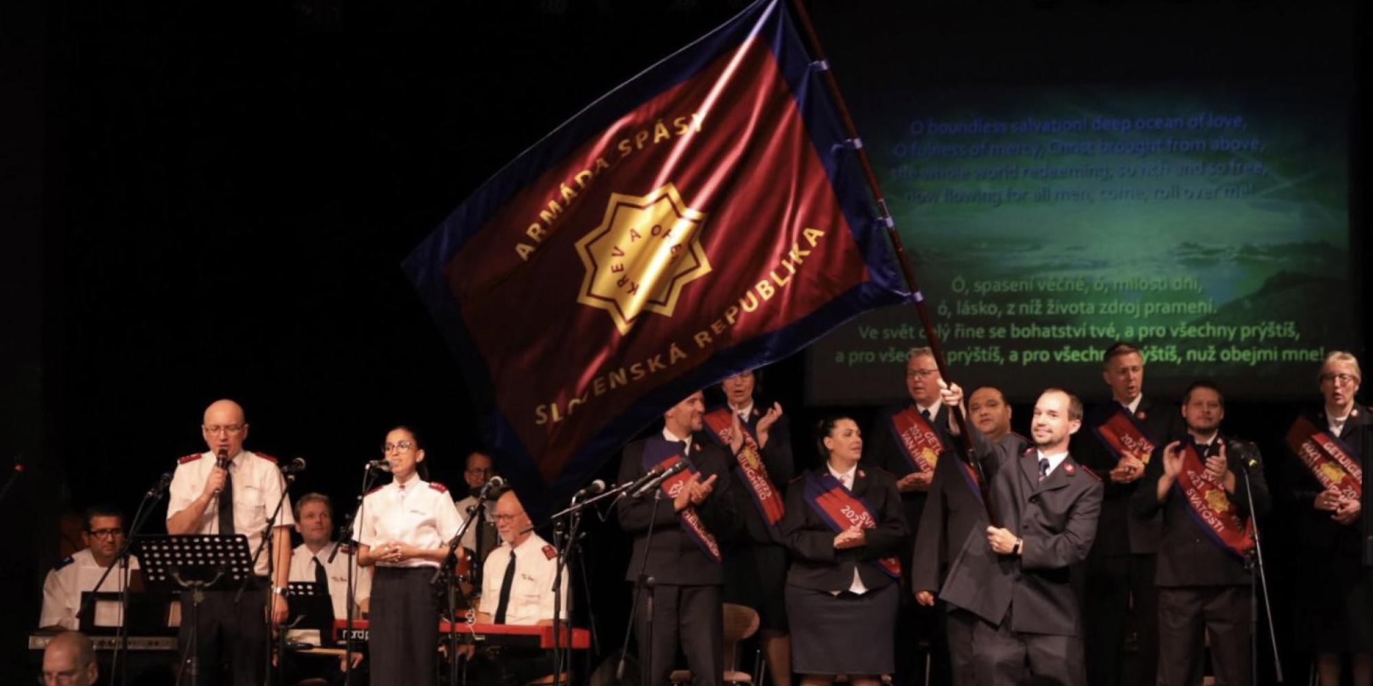 A Salvationist waves the Slovakian Salvation Army flag