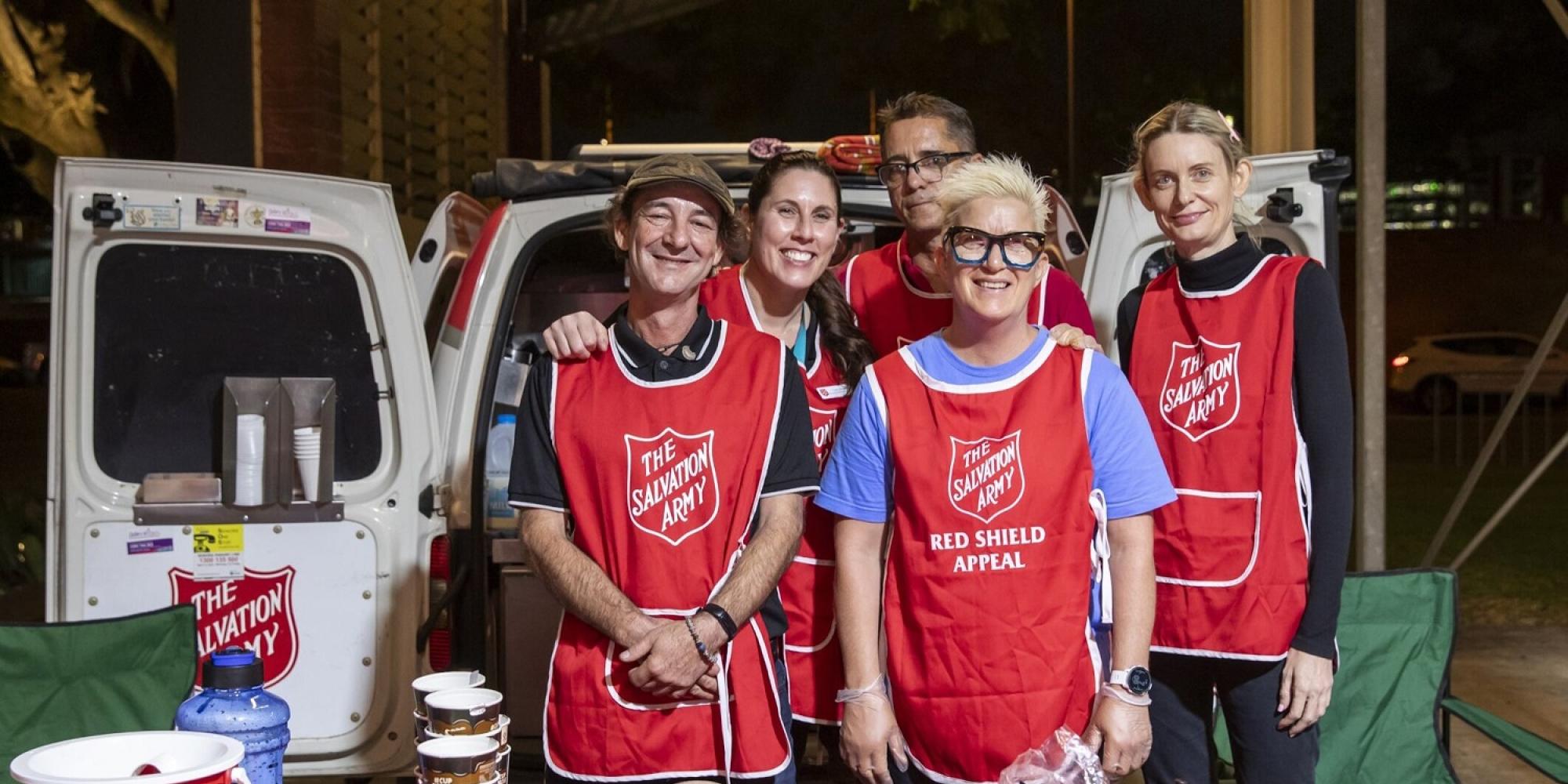 Salvation Army volunteers wearing red Army tabards
