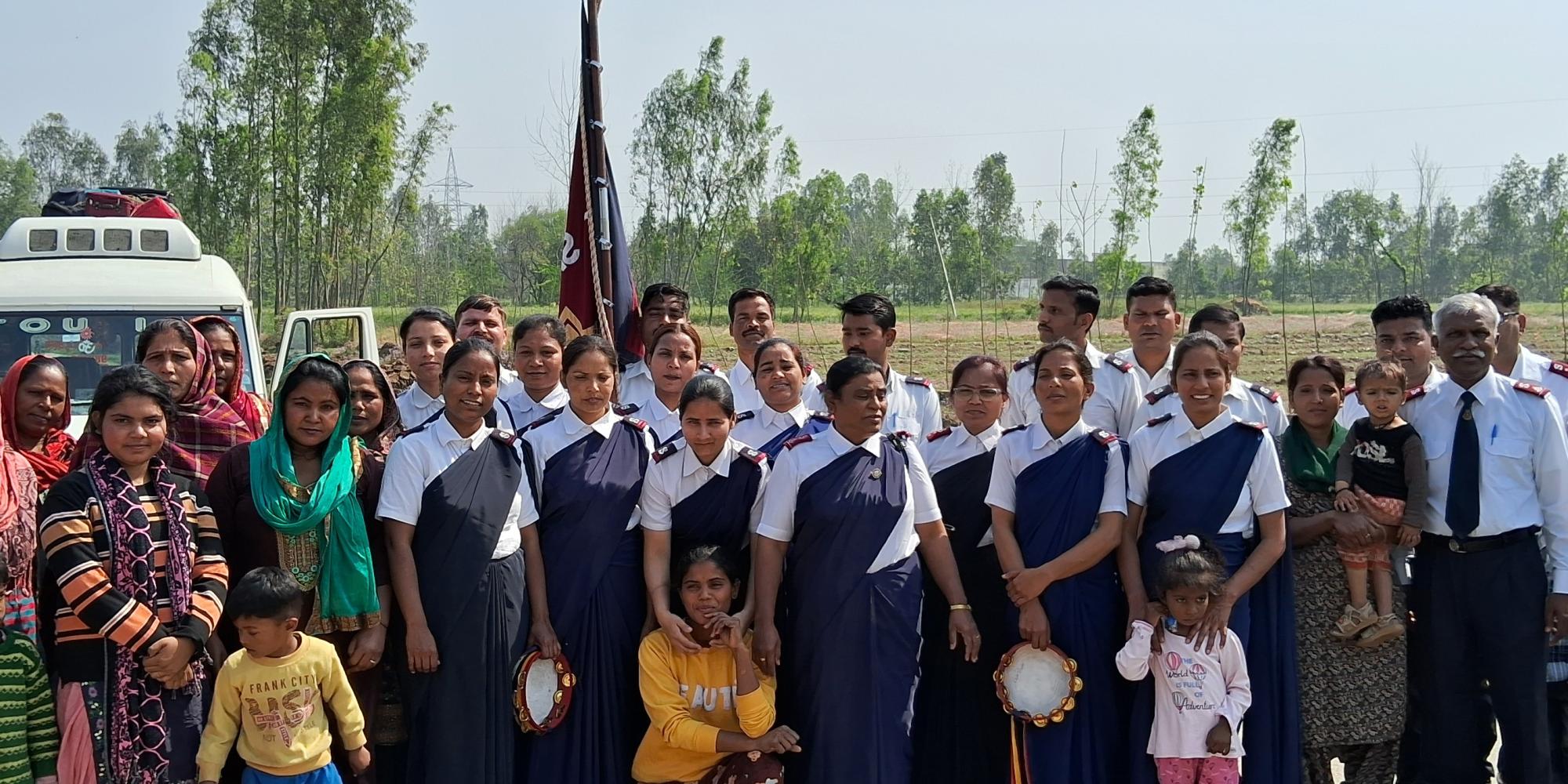 A large group, some wearing Salvation Army uniform