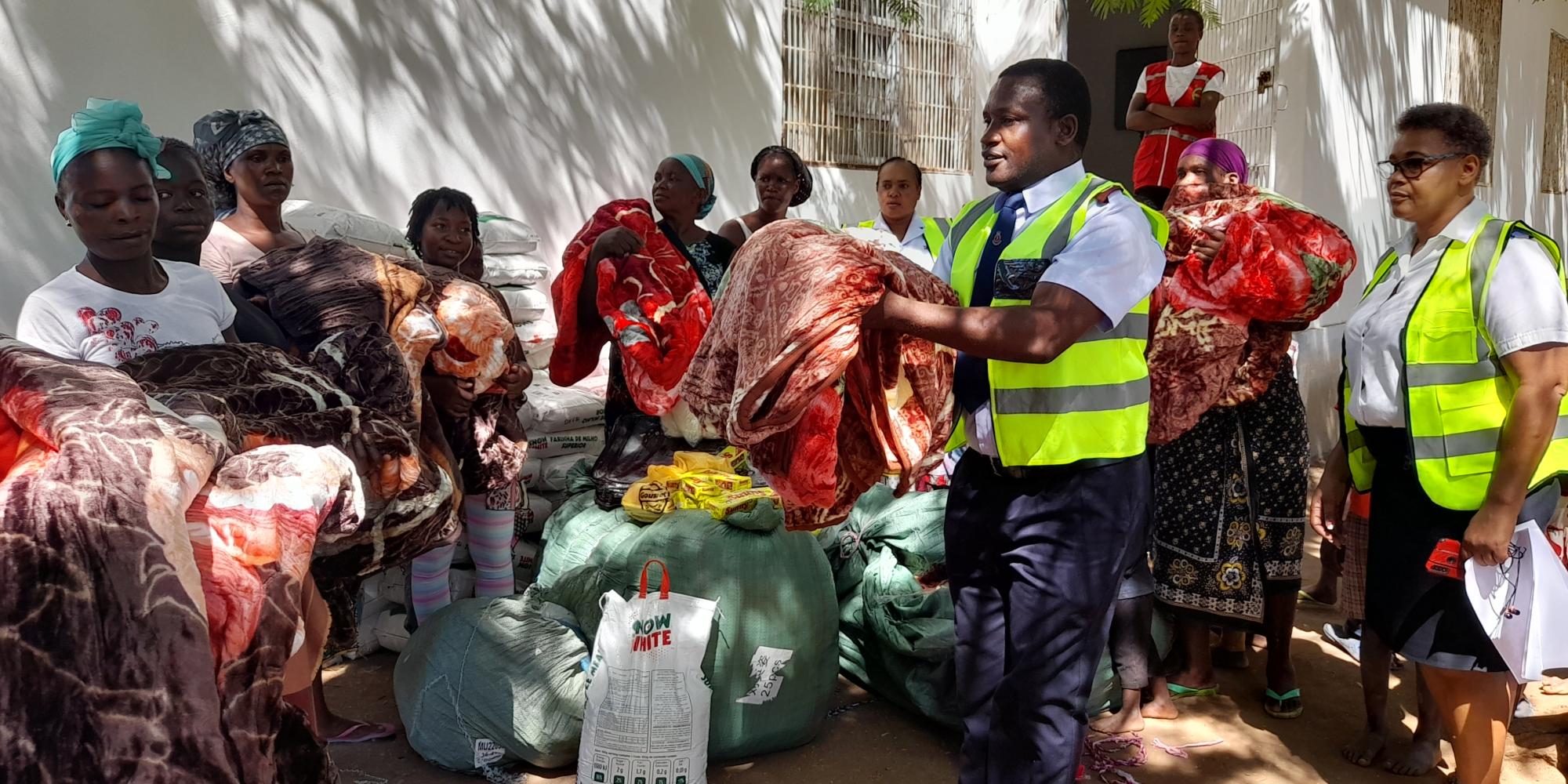 A Salvation Army officer hands out blankets