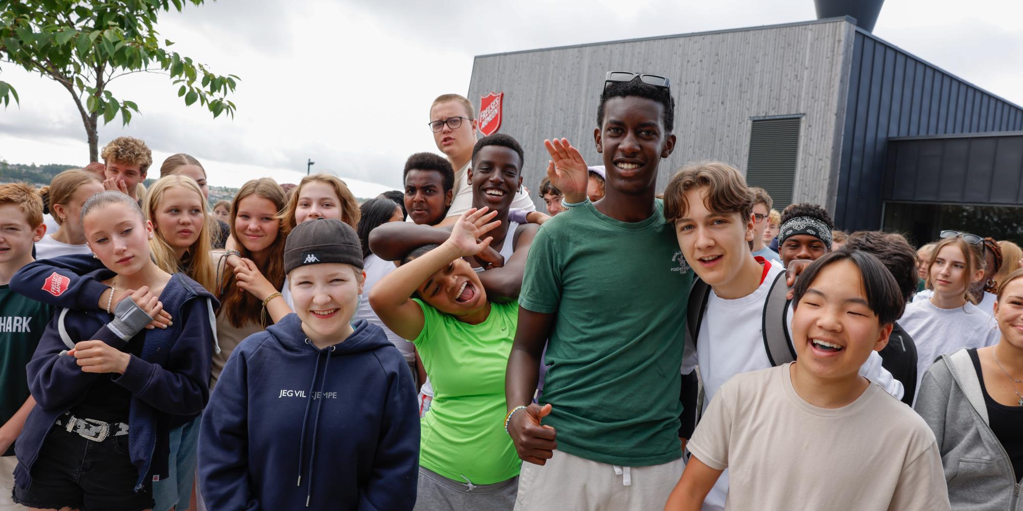 A group of young people outside a Salvation Army building