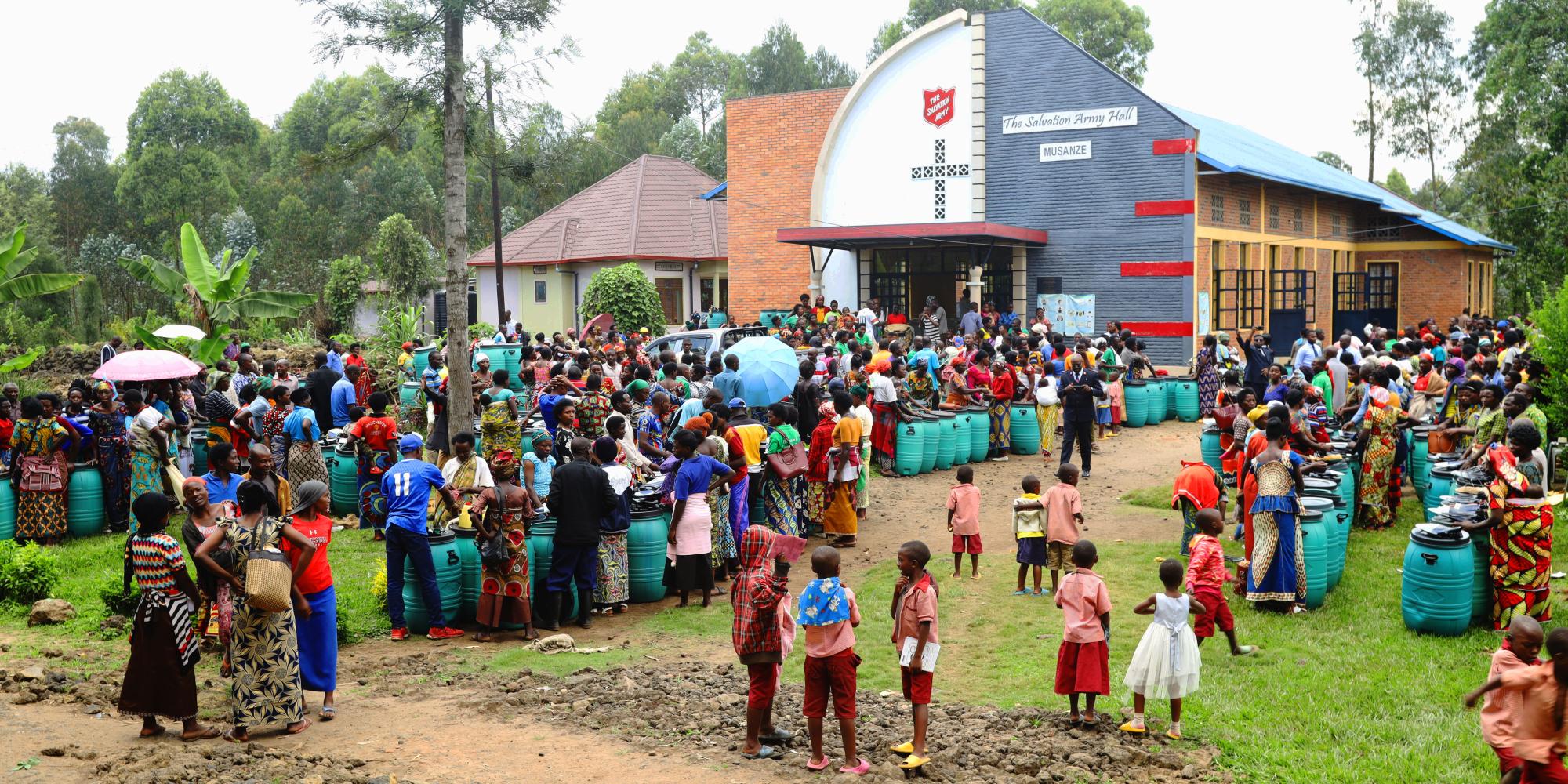A crowd of people outside a Salvation Army hall