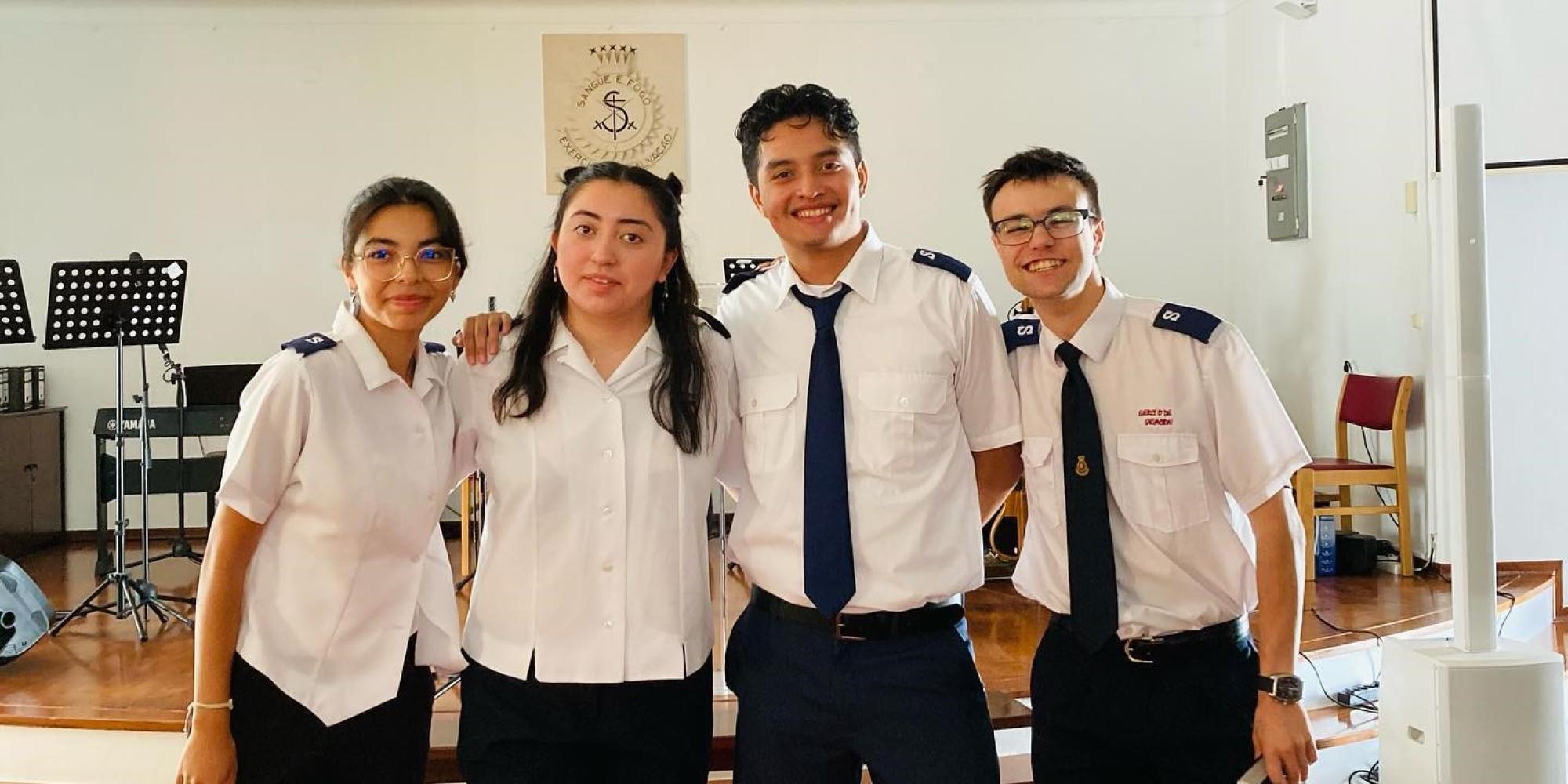 Four people in Salvation Army uniform