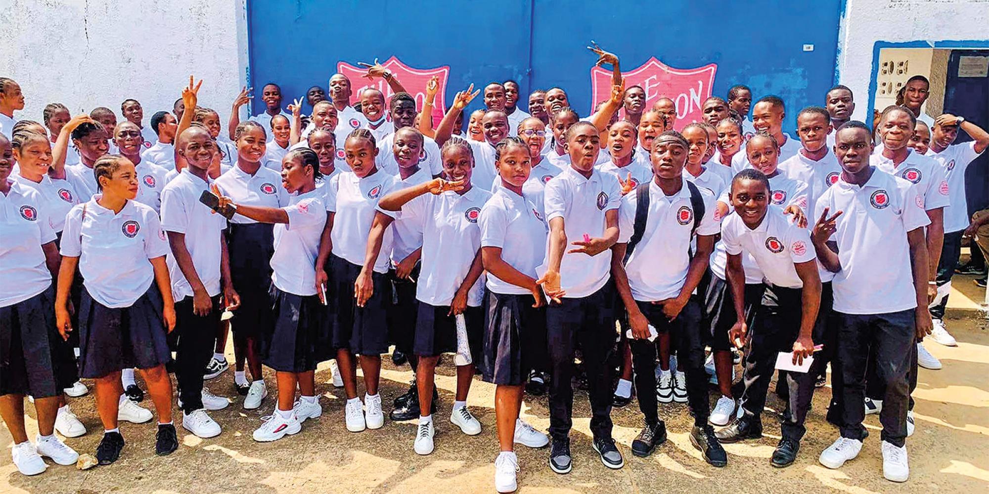 A large group of students pose for the camera