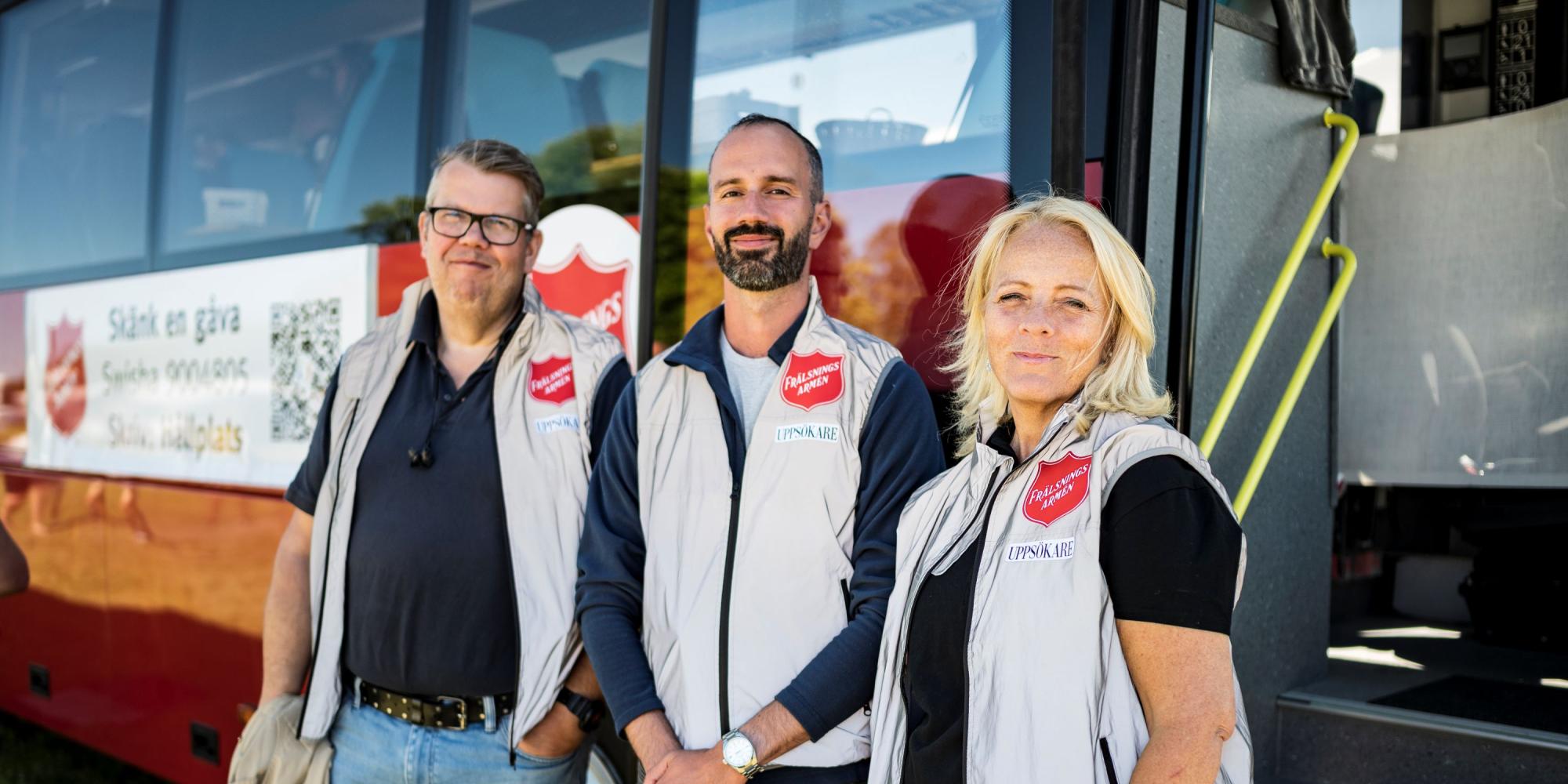 Three people in Salvation Army jackets