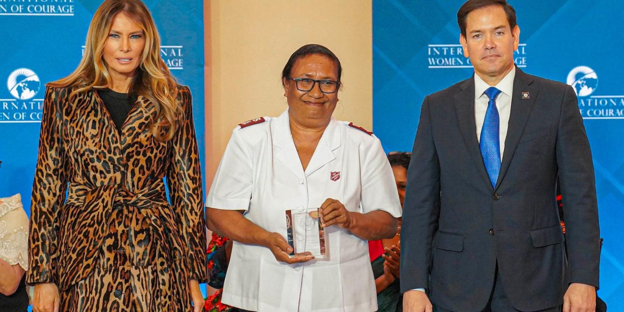 Major Velena Iga (centre) with her award, alongside Melania Trump and Marco Rubio