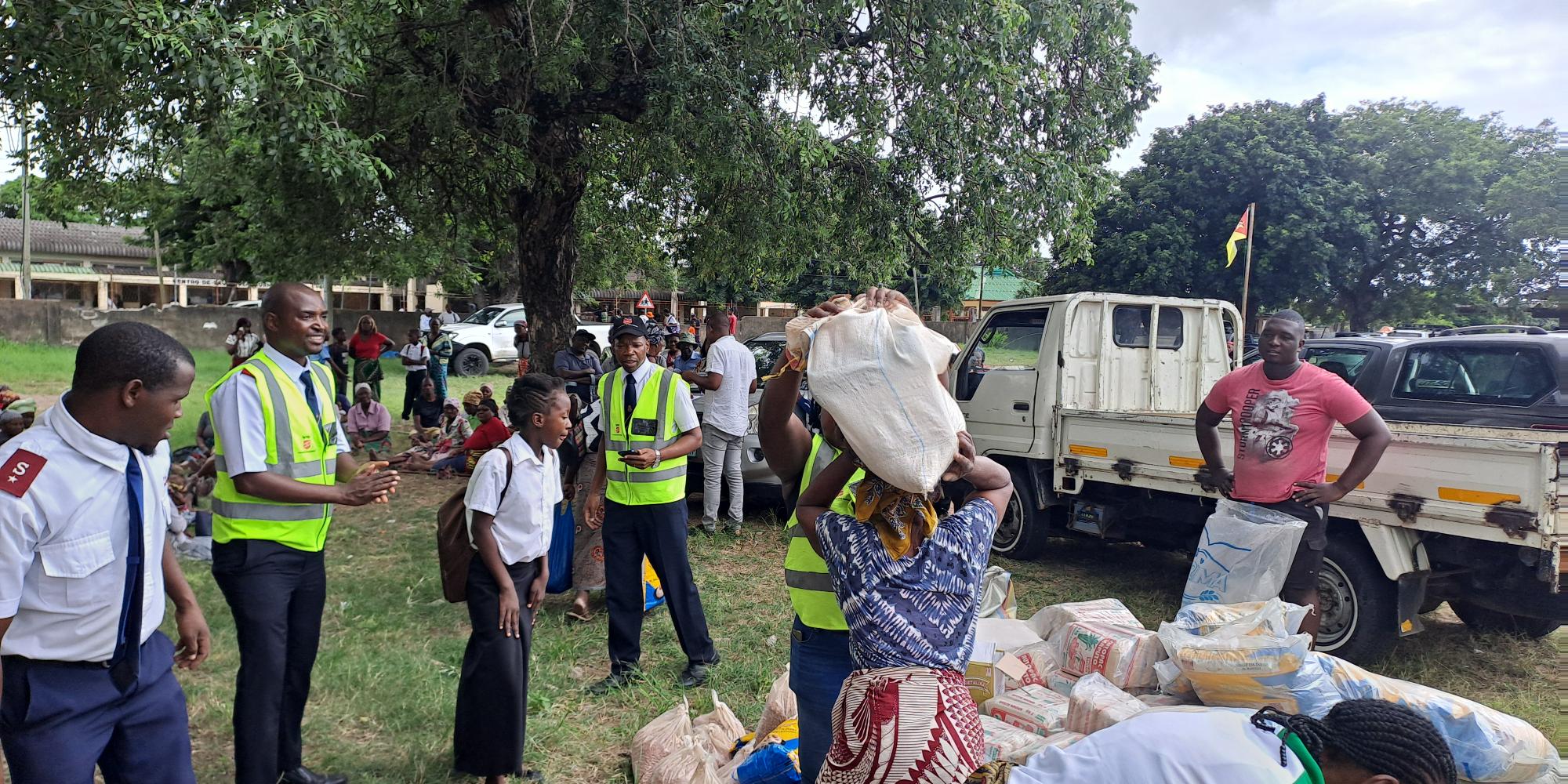 People in Salvation Army hi-vis jackets distribute supplies