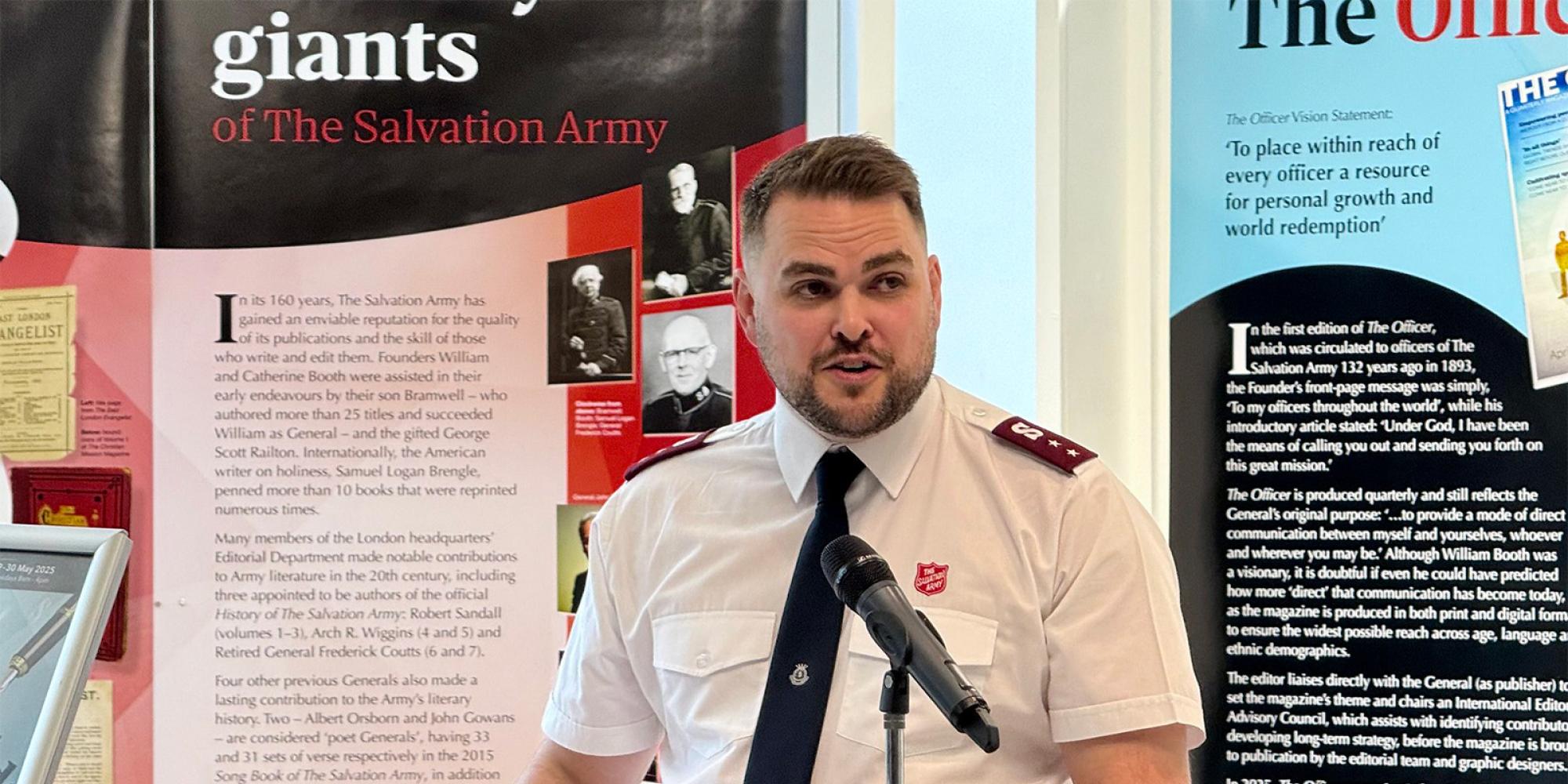 Captain John Clifton speaks in front of the literary exhibition
