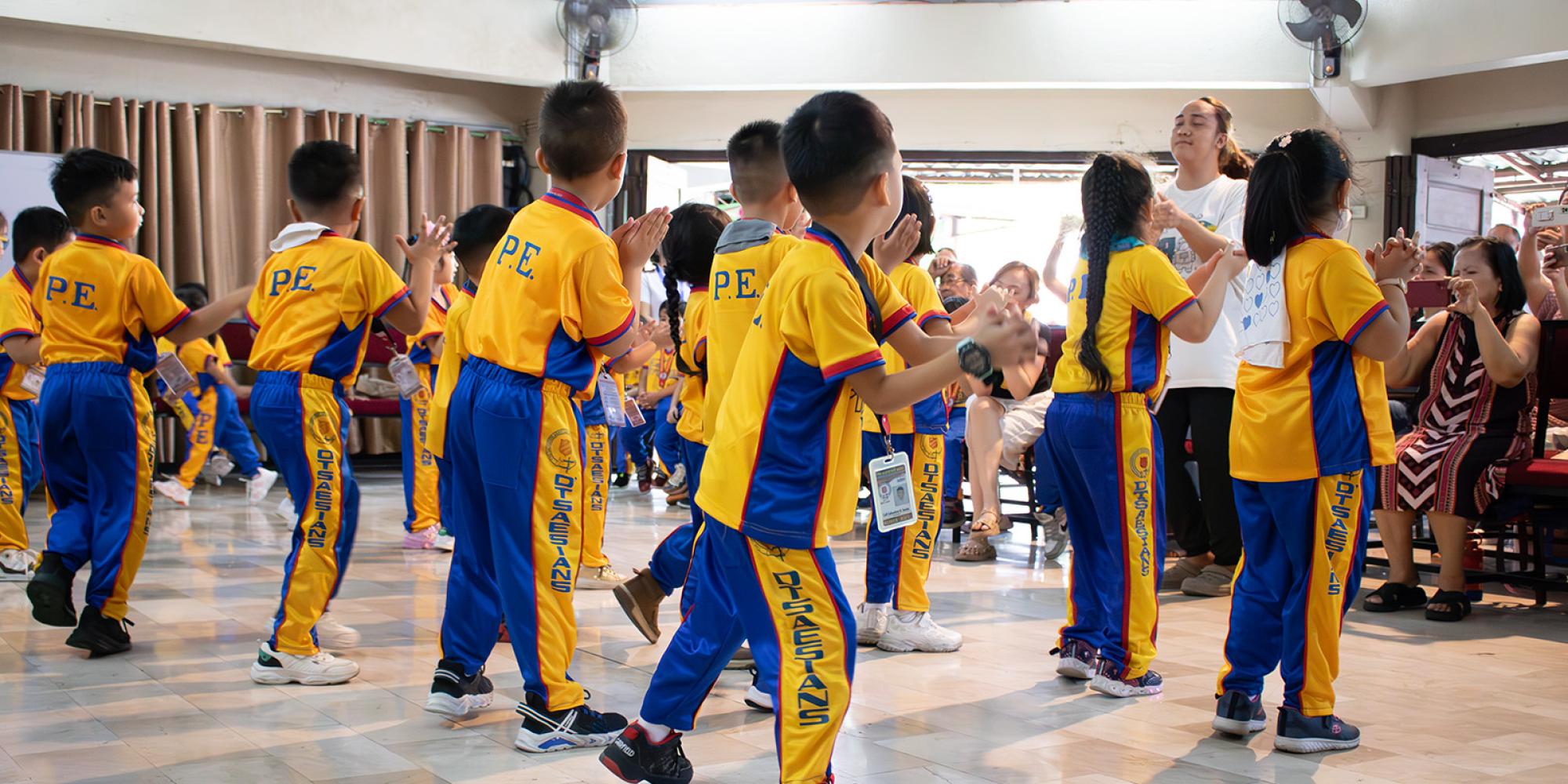 Young people take part in a dance routine