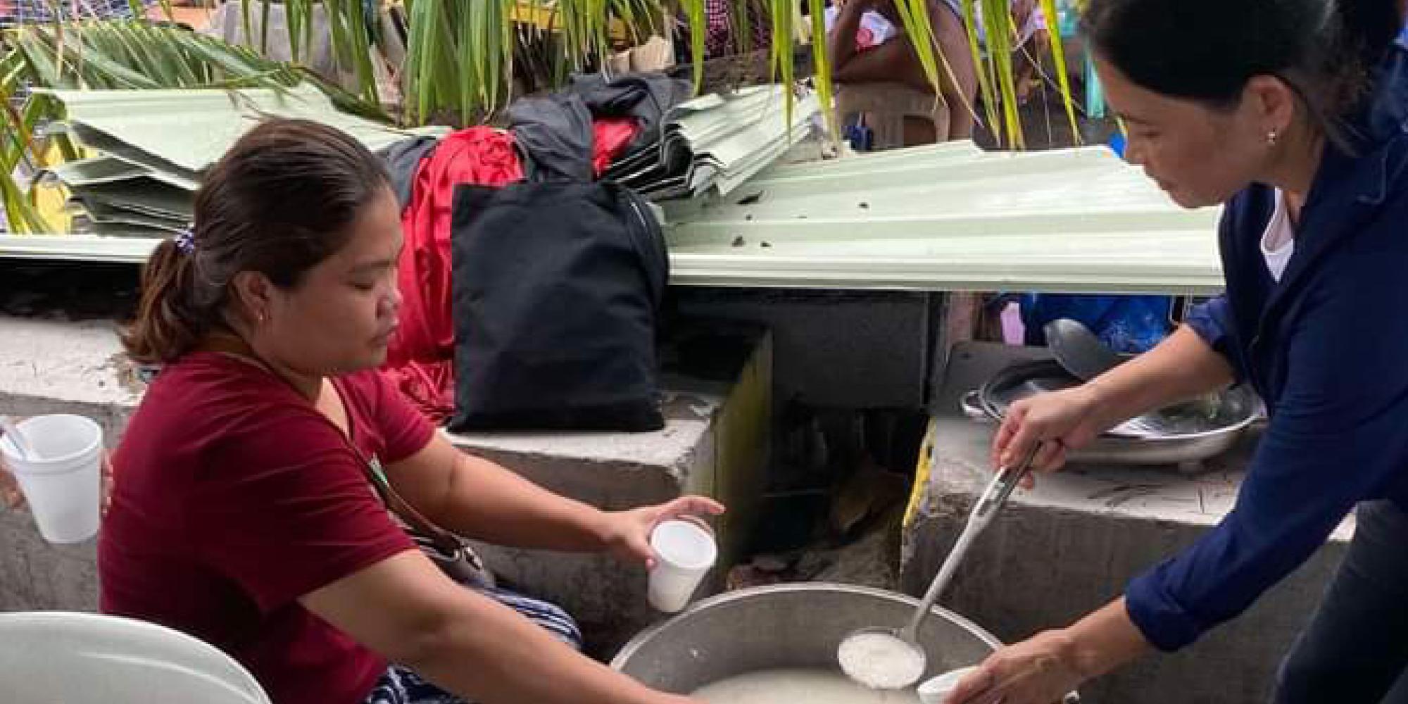 A Salvation Army volunteer serves food