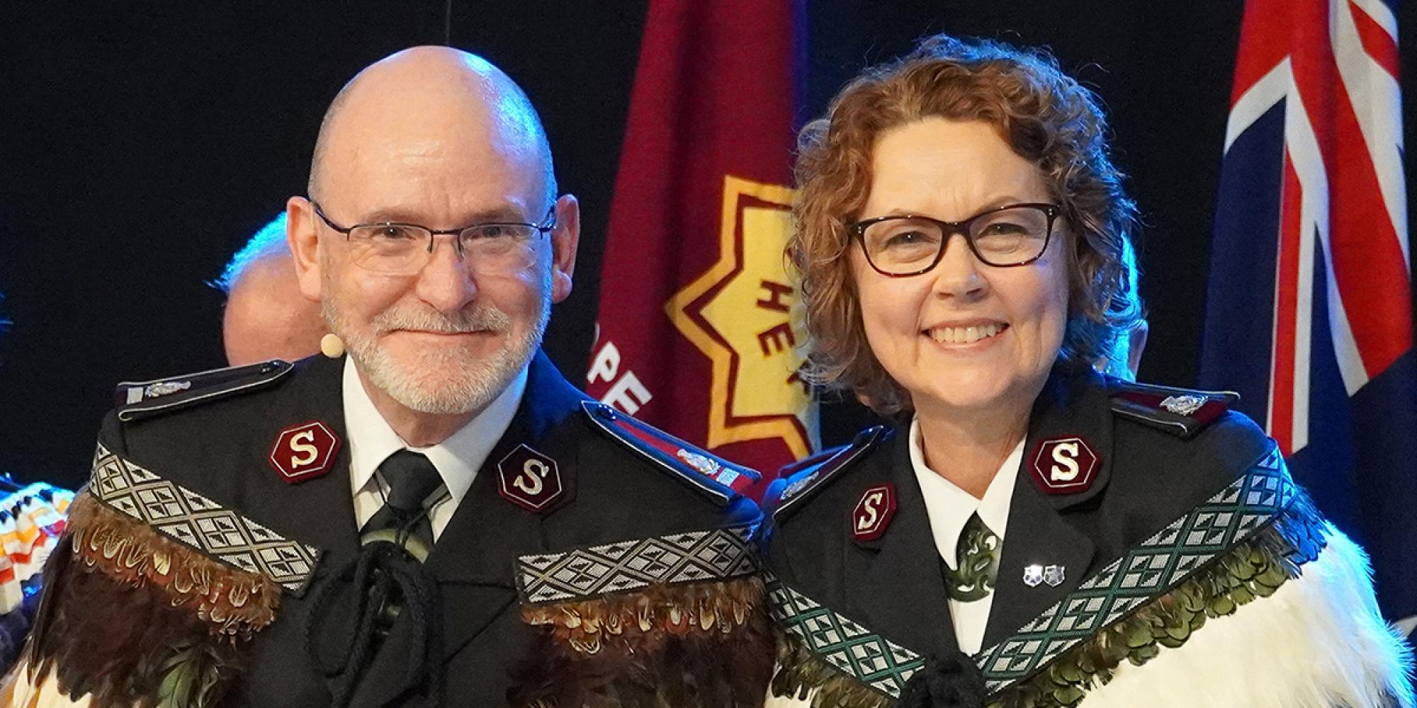 General Lyndon Buckingham and Commissioner Bronwyn Buckingham in full Salvation Army uniform and feathered Korowai (Māori cloak)