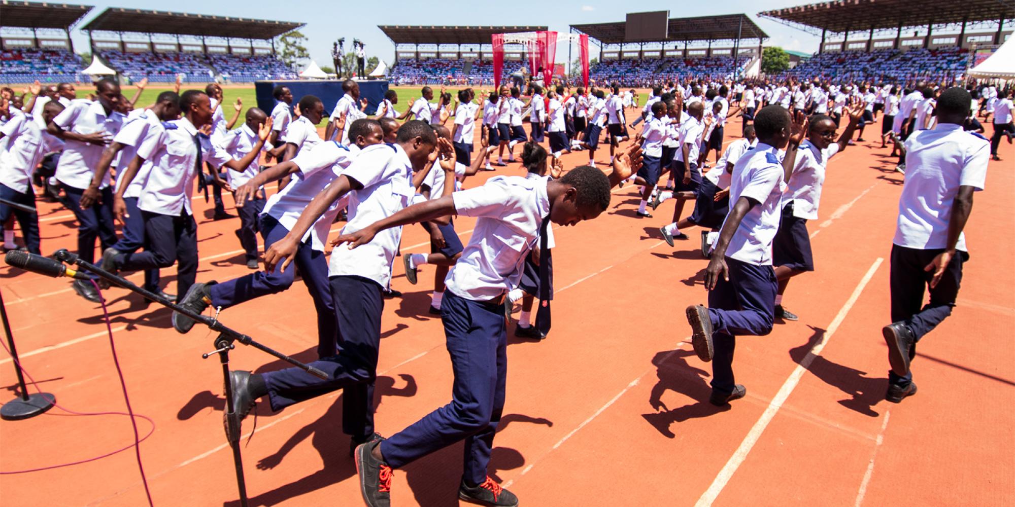 Young people dance in the stadium