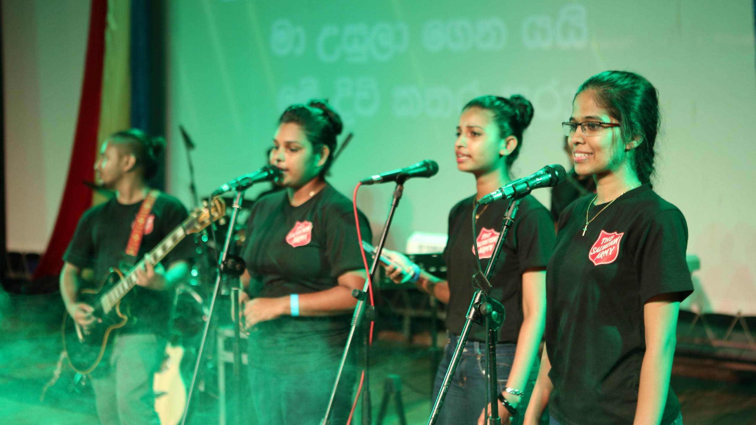 A worship band wearing Salvation Army t-shirts
