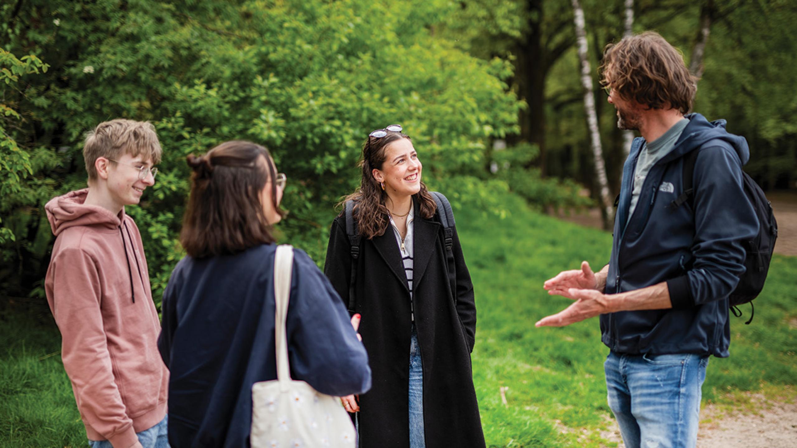A group stand to chat outside in nature