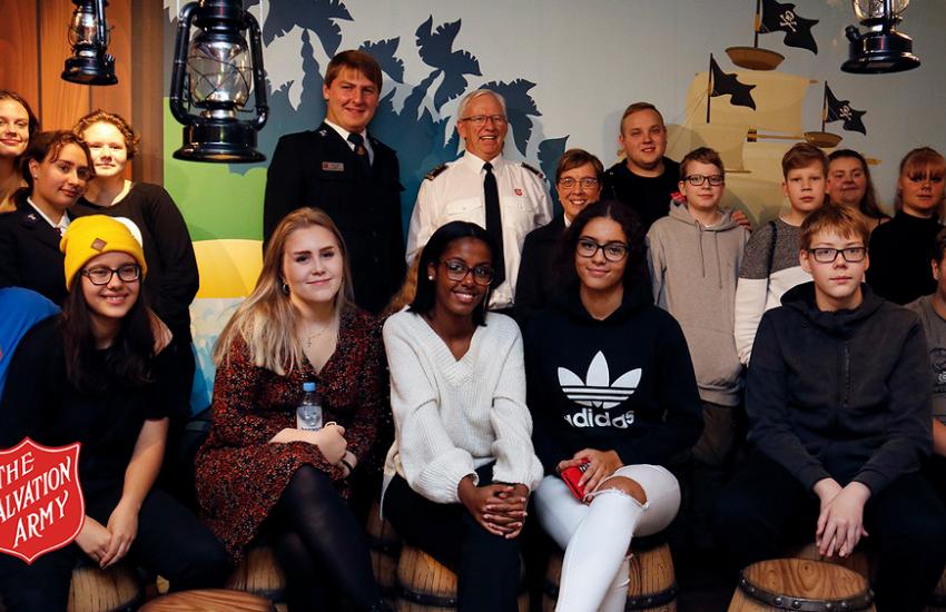 General with young people in Finland