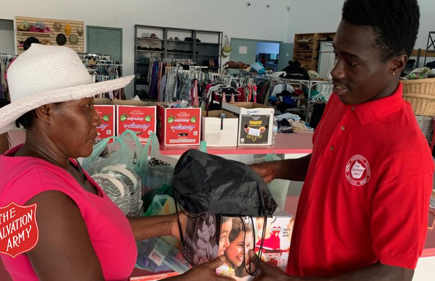 Akeem Cooper helping at the Freeport Salvation Army centre
