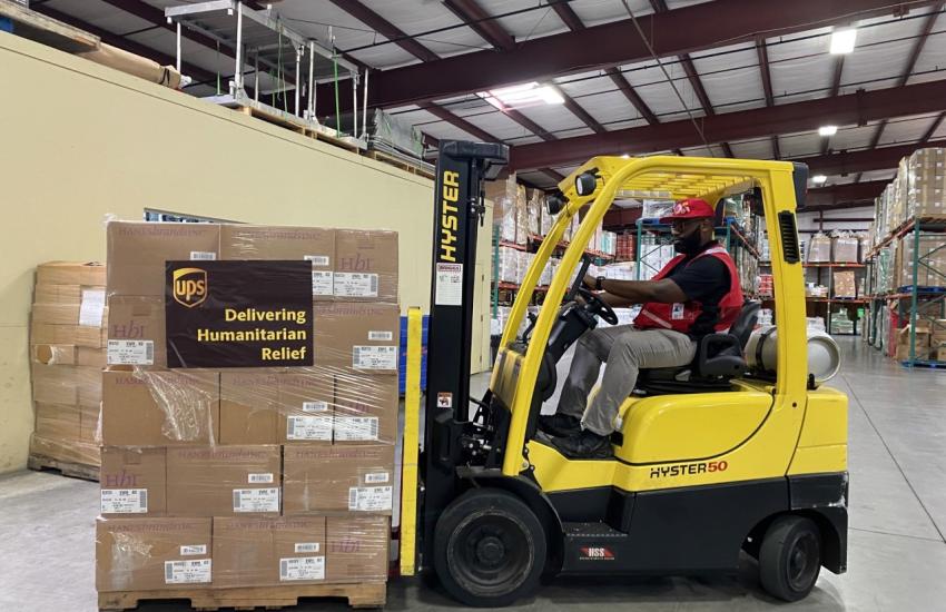 Fork-lift truck loading Salvation Army emergency supplies