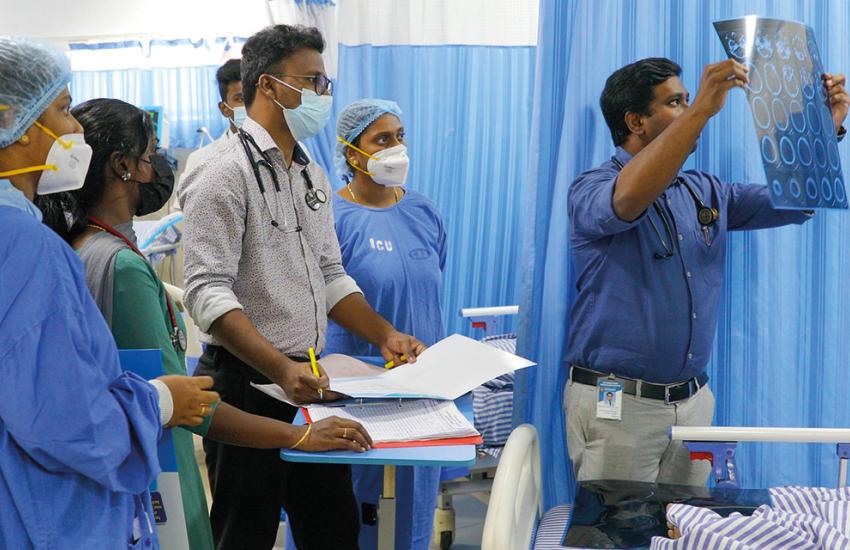 Doctors view test results at a Salvation Army hospital in India