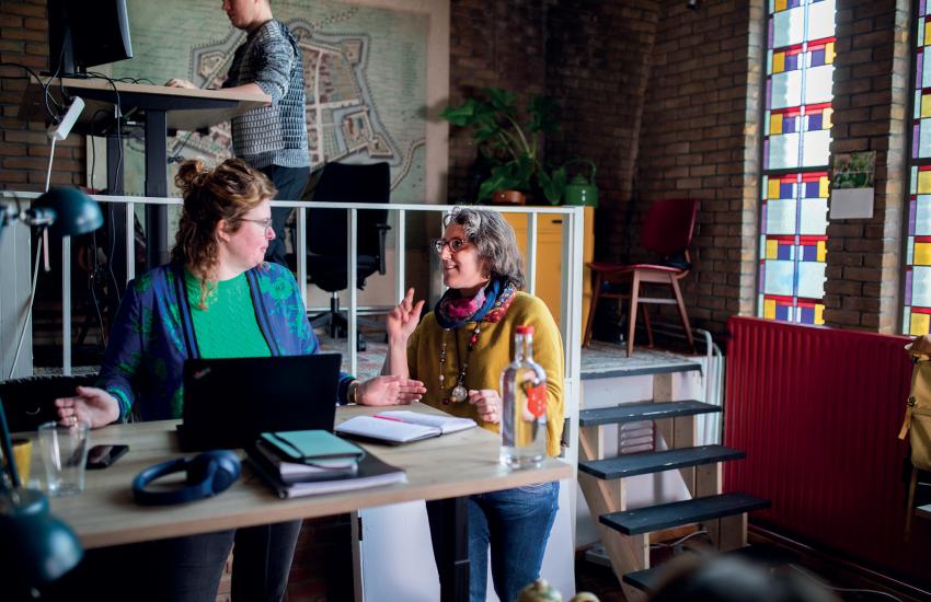 Women have a conversation in the Flex Workspace