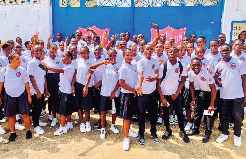 A large group of students pose for the camera